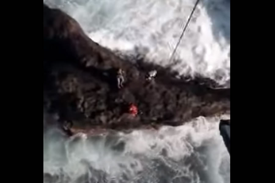 VIDEO: Helicopter rescue of injured fisherman trapped on rocks by rough seas