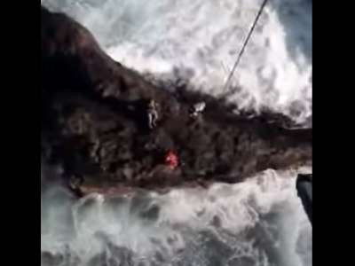 VIDEO: Helicopter rescue of injured fisherman trapped on rocks by rough seas