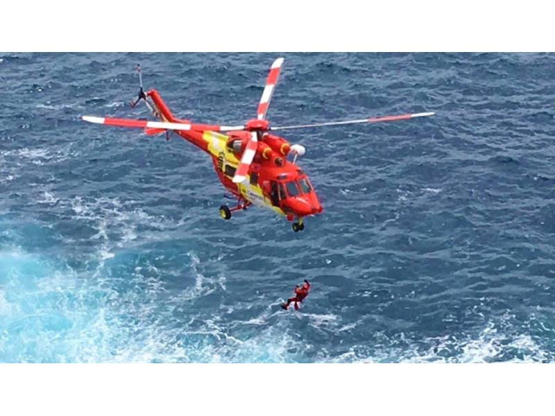 Woman rescued from sea by helicopter after breaking collar bone Woman rescued from sea by helicopter after breaking collar bone