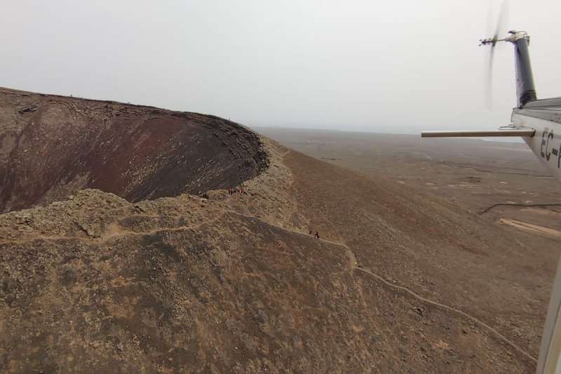 Woman rescued by helicopter after falling into the crater of a volcano