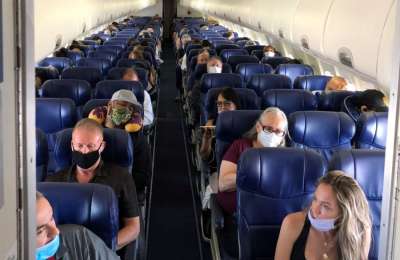 Mandatory face masks on flights 'could be enforced for years' 