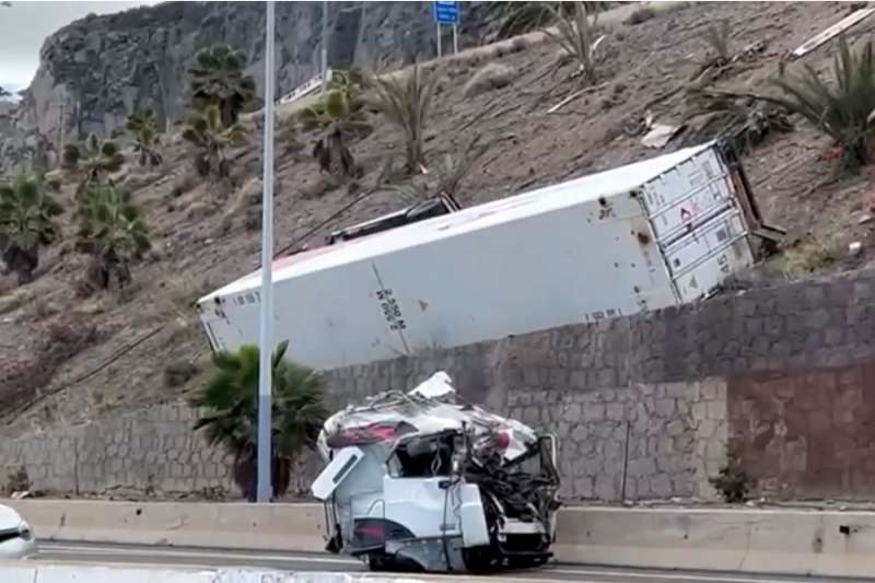 Lorry driver killed as truck veers off road and rolls down a steep hill 