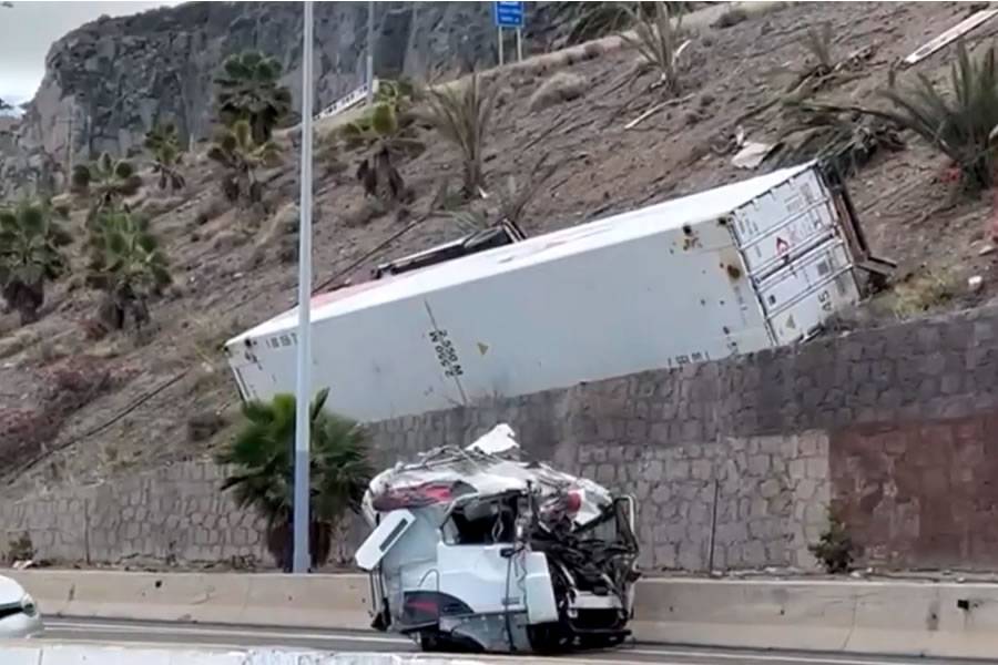 Lorry driver killed as truck veers off road and rolls down a steep hill 