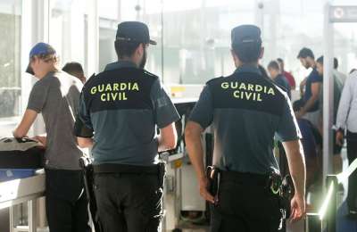 British tourist attacks three policemen as they were escorting him off a plane