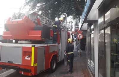 Firemen smash open an apartment to stop a man committing suicide