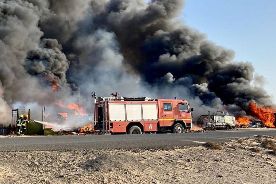 Almost 50 motorhomes go up in flames as fire spreads through a caravan park