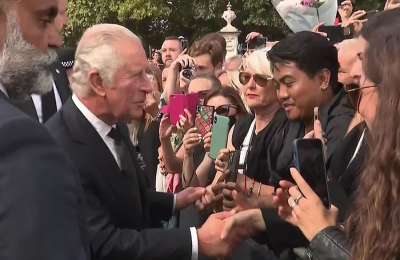 King Charles and Queen Consort greet crowds outside Buckingham Palace