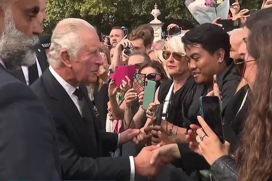King Charles and Queen Consort greet crowds outside Buckingham Palace
