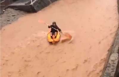 Kayaking and ‘rain’ surfing down the streets during tropical storm Hermine