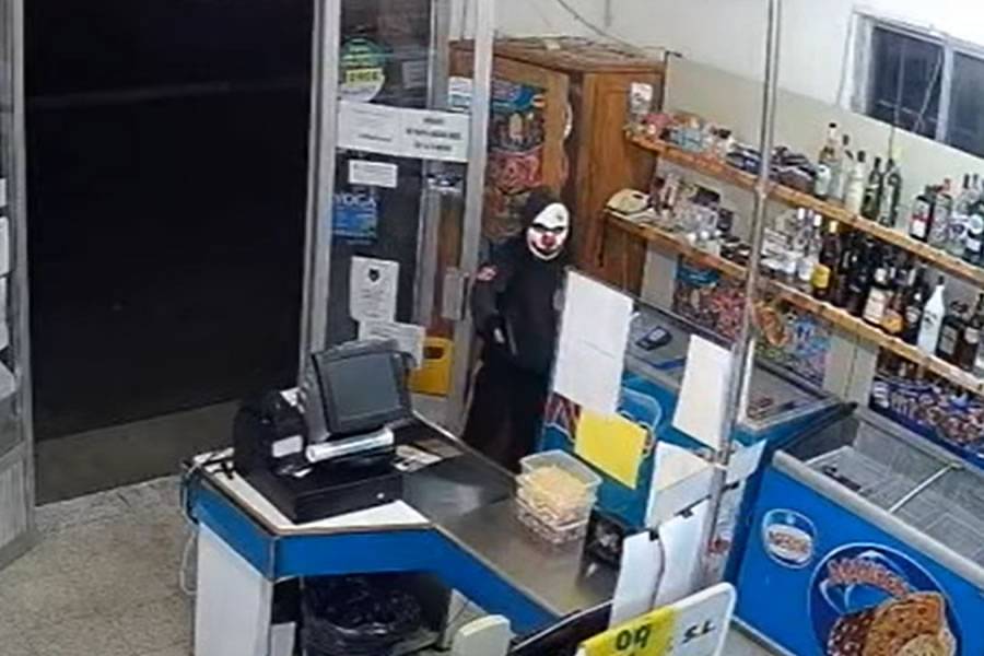 VIDEO: A supermarket is robbed at gunpoint by man wearing a clown mask