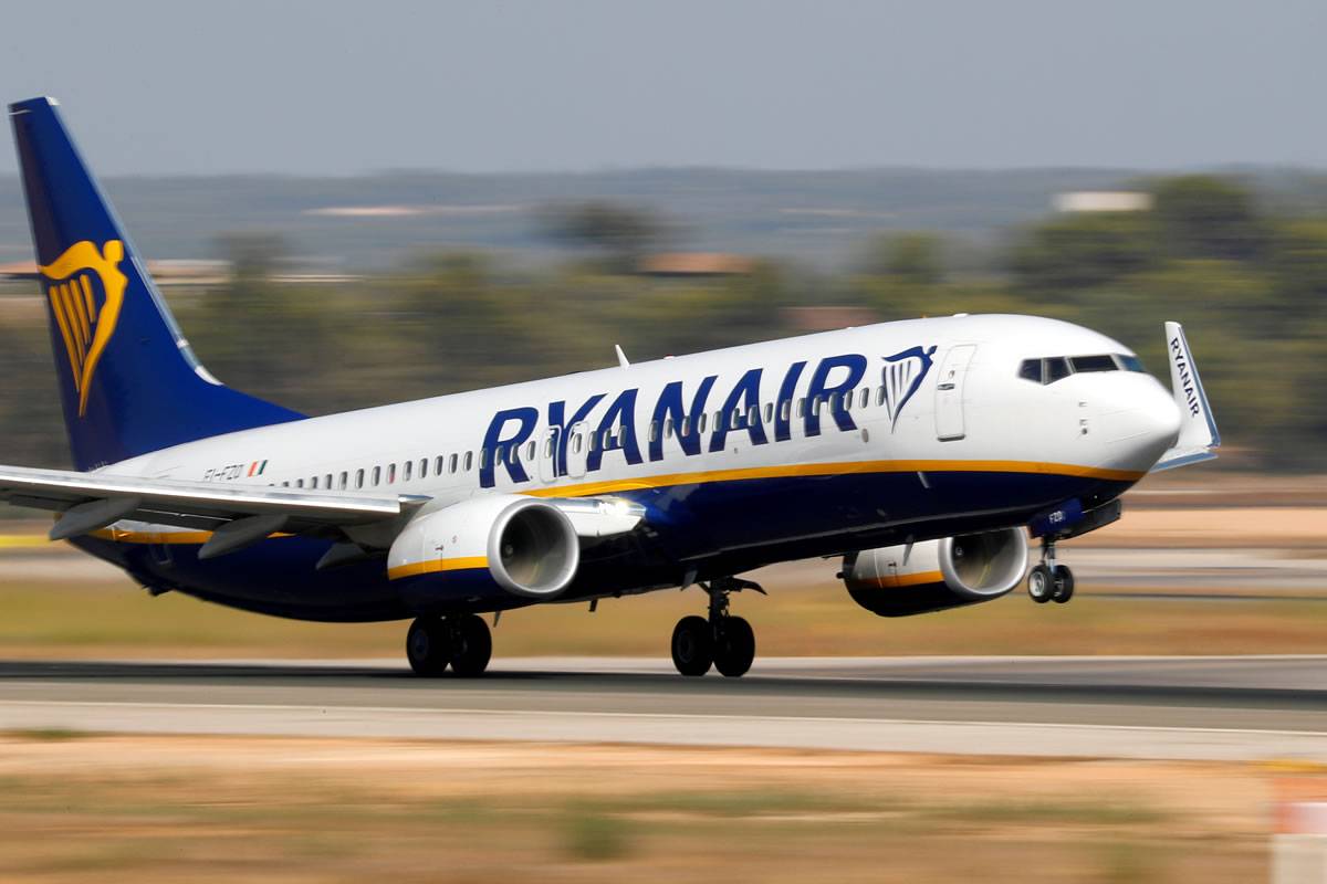 Police meet Ryanair flight from the UK at Tenerife south airport after trouble on board