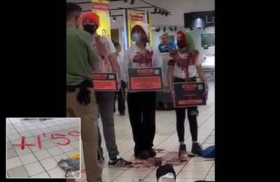 Activists chain themselves together in a Tenerife supermarket in protest against climate change