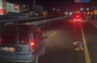 VIDEO: Man stops car on TF-1 motorway to get out and roll around on the floor