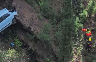 The dead body of a woman is found in a car at the bottom of a ravine