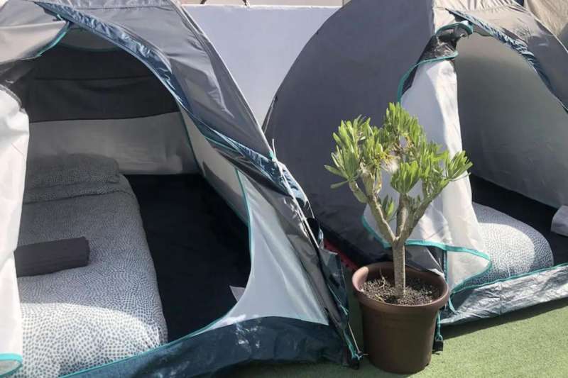 A man sets up tents on his roof terrace in Lanzarote and rents them out on Airbnb