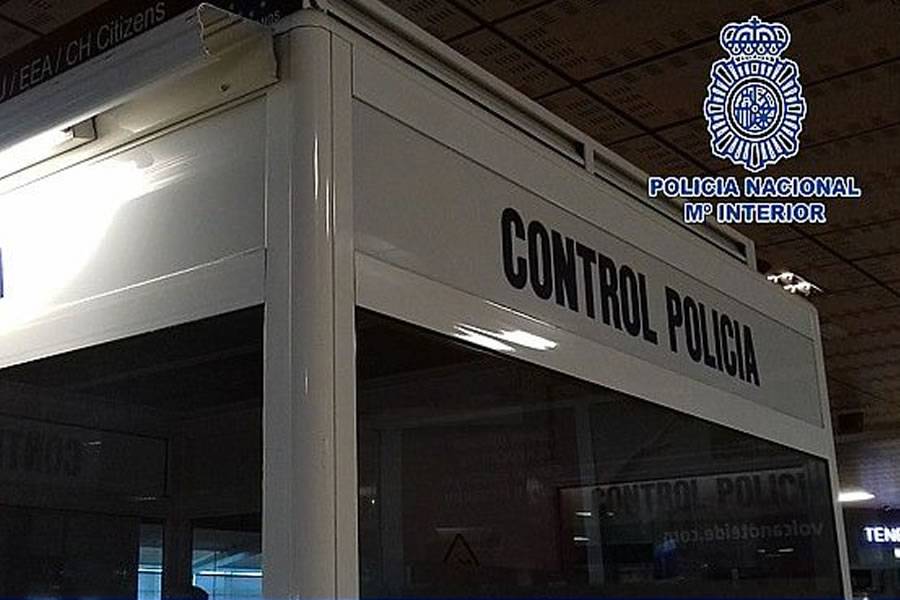 A tourist is revived by police officers at Tenerife South airport A tourist is revived by police officers at Tenerife South airport