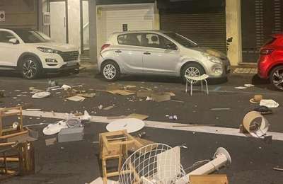 A tourist destroys a holiday home and throws furniture onto the street from a window