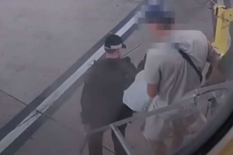 Police escort passenger off plane after he was caught smoking in the toilet