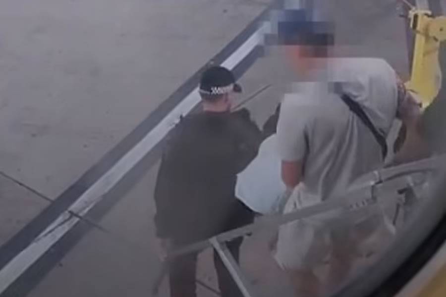 Police escort passenger off plane after he was caught smoking in the toilet