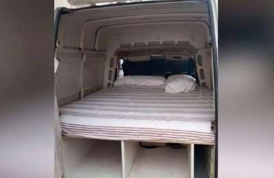 A small van with a mattress is offered as a holiday let for 40 euros a day