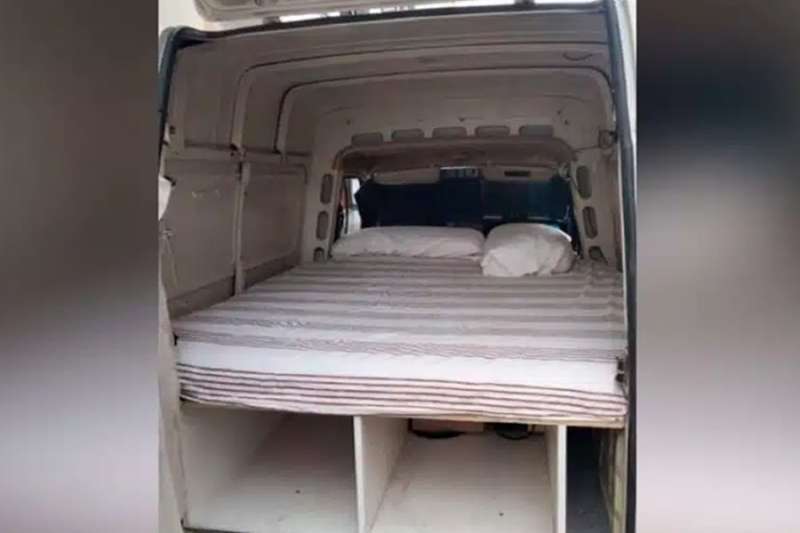 A small van with a mattress is offered as a holiday let for 40 euros a day