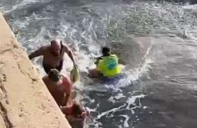 VIDEO: Bathers battle to save child who is dragged out to sea