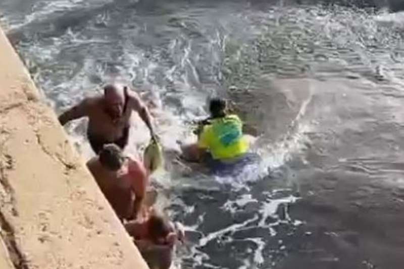 VIDEO: Bathers battle to save child who is dragged out to sea