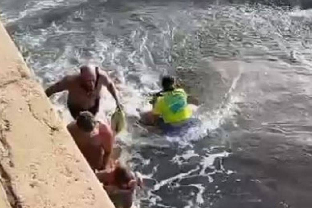 VIDEO: Bathers battle to save child who is dragged out to sea