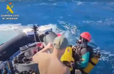 Divers investigate a sea cave as search continues for the two missing teenagers