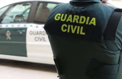 Police are hunting a Scottish holidaymaker who headbutted a Guardia Civil officer