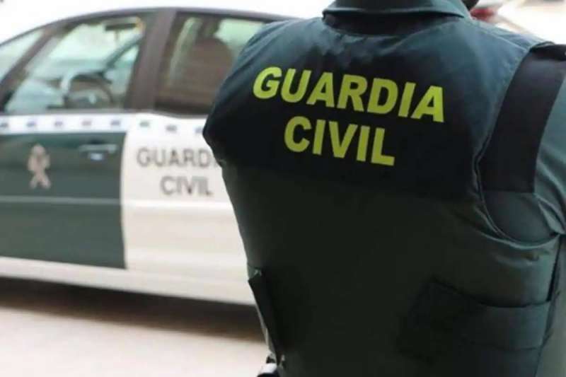 Police are hunting a Scottish holidaymaker who headbutted a Guardia Civil officer
