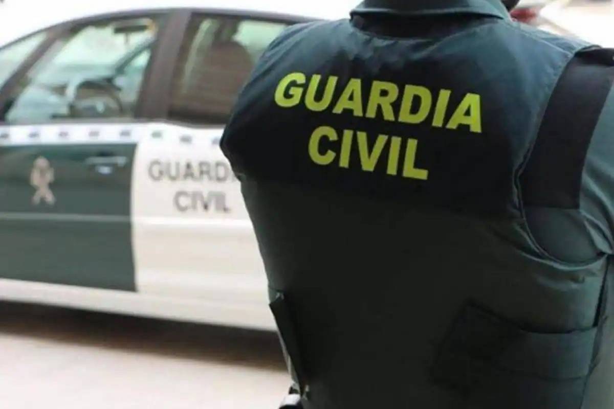 Police are hunting a Scottish holidaymaker who headbutted a Guardia Civil officer