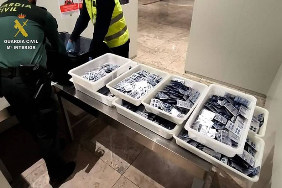 Woman detained at airport after 20,000 diamond-shaped blue pills found in luggage