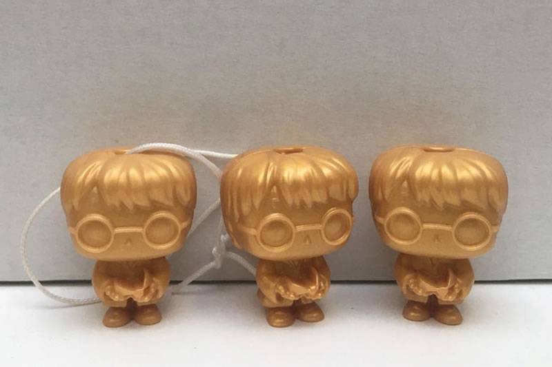 Young girl's magical luck as she finds three rare Harry Potter Funko Figures in Kinder eggs