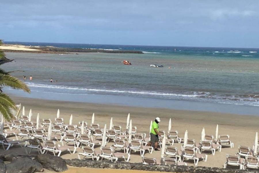 Dead swimmer is retrieved from the sea off Costa Teguise