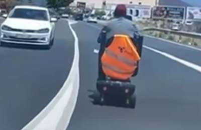 Man on a mobility scooter videoed on main road during rush hour in southern Tenerife