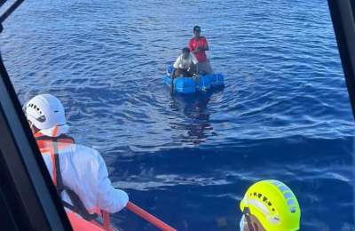 Two migrants survive 11 hours at sea on oil drums after boat runs out of fuel 